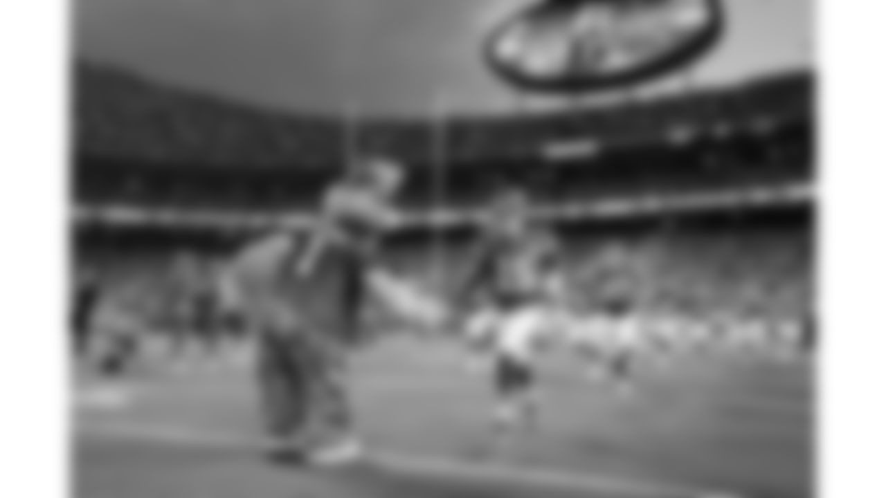 Kansas City Chiefs quarterback Patrick Mahomes (15) high fives KC Wolf as he run onto the field prior to the Week 1 NFL Kickoff Game against the Baltimore Ravens on Thursday, September 5, 2024.