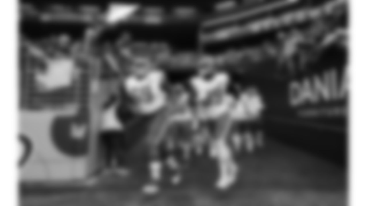 Kansas City Chiefs nose tackle Mike Pennel (69) and defensive lineman Jerry Tillery (99) run onto the field prior to a preseason week 2 NFL football game against the Seattle Seahawks, Friday, August 15, 2025 in Seattle, WA.