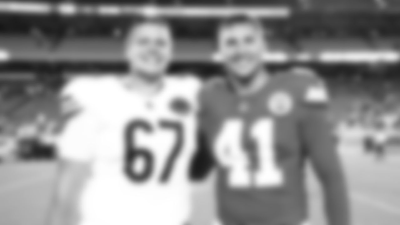 Kansas City Chiefs long snapper James Winchester (41) and Chicago Bears defensive back Tyrique Stevenson (29) aafter a preseason week 3 NFL football game against the Chicago Bears, Friday, August 22, 2025 in Kansas City, MO.
