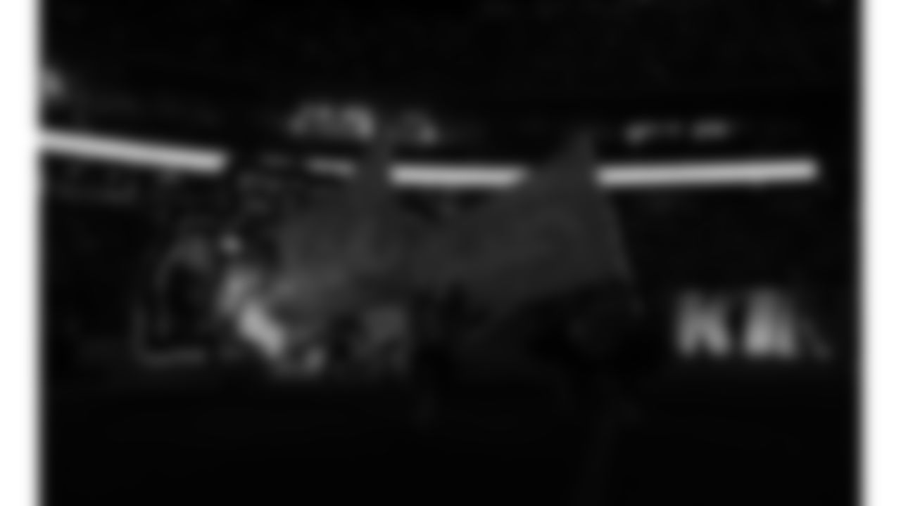 Chiefs Flag Runners enter the field prior to a week 14 NFL Football game against the Houston Texans on Sunday, December 7, 2025 in Kansas City, MO.