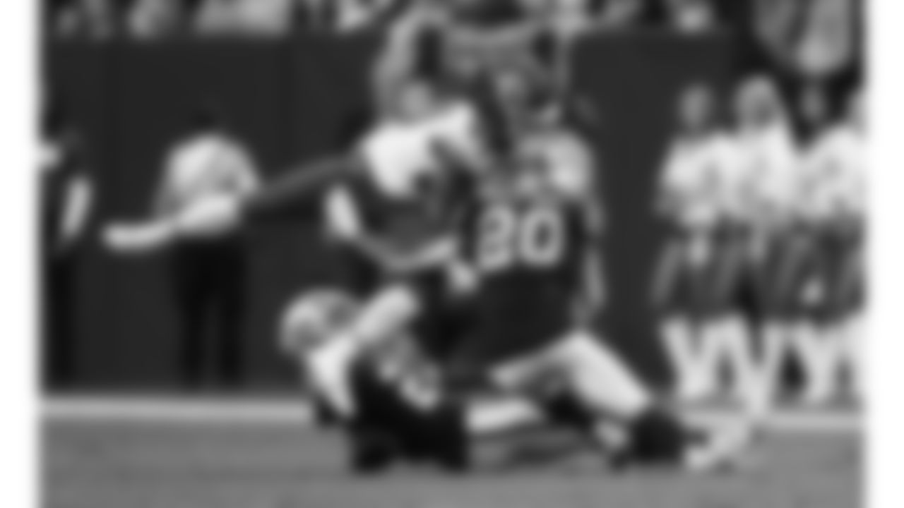 Las Vegas Raiders safety Isaiah Pola-Mao (20) hits Kansas City Chiefs running back Kareem Hunt (29) during a week 18 NFL football game, Sunday, January 4, 2026 in Las Vegas, NV.