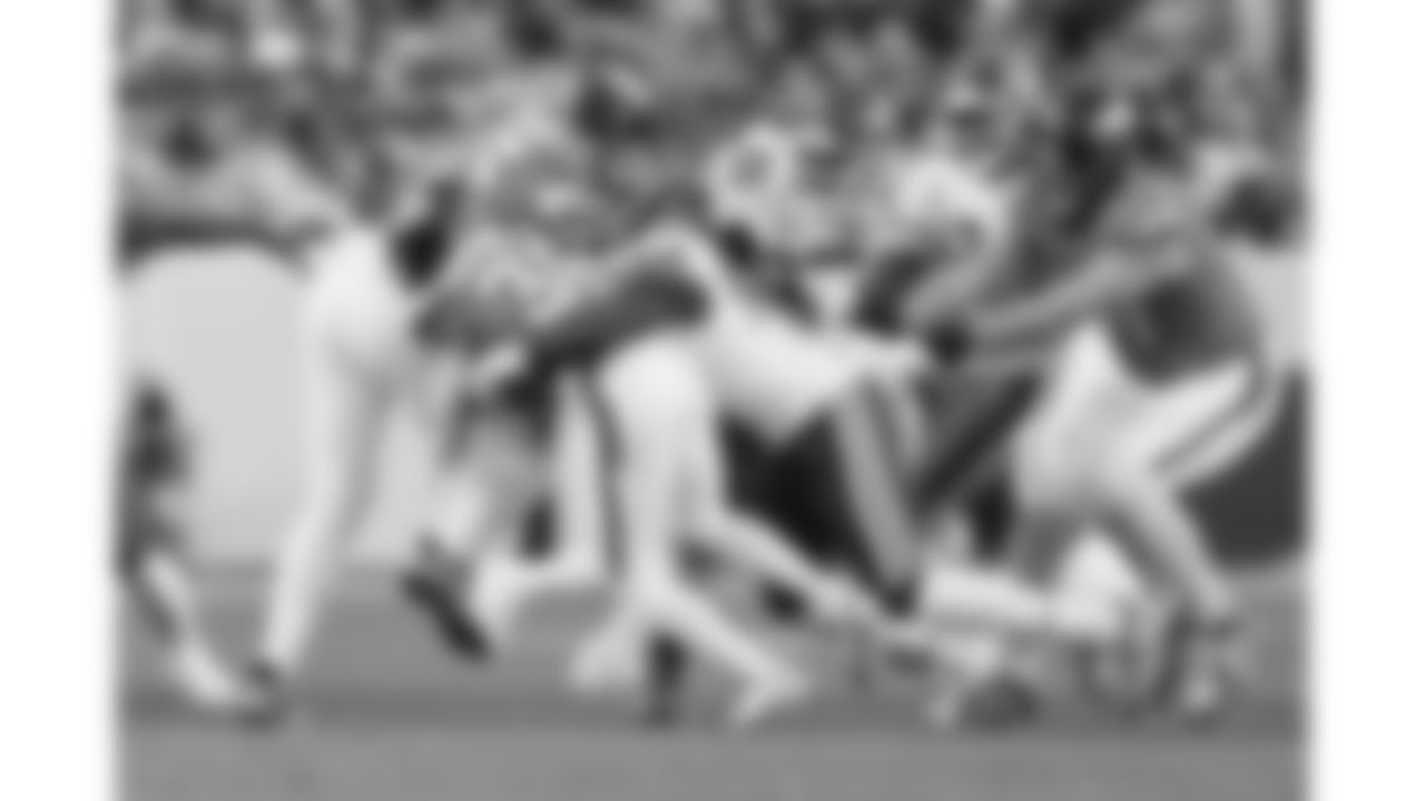 Kansas City Chiefs defensive end Charles Omenihu (90) tackles Denver Broncos running back Jaleel McLaughlin (38) during a week 11 NFL football game, Sunday, November 16, 2025 in Denver, CO.