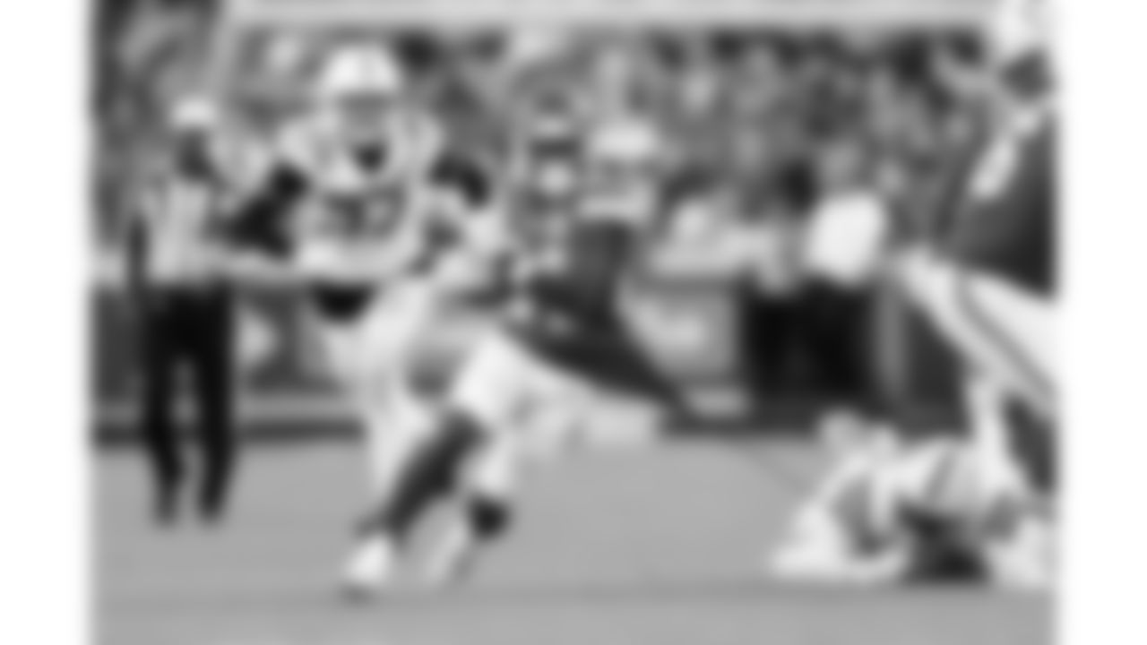 Kansas City Chiefs running back Brashard Smith (24) gets his shirt torn while he runs the ball during a week 12 NFL football game against the Indianapolis Colts, Sunday, November 23, 2025 in Kansas City, MO.