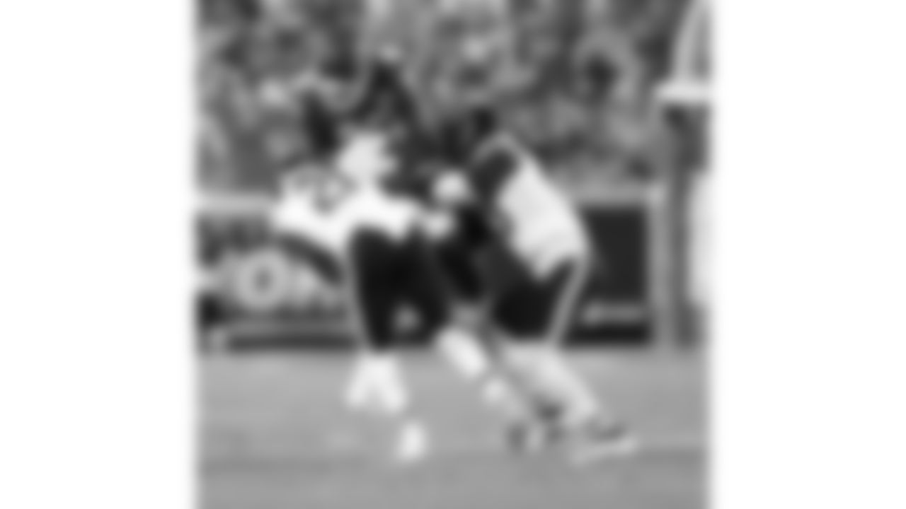 Kansas City Chiefs tight end Tre Watson (49) gets hit by Chicago Bears safety Mark Perry (21) and linebacker Carl Jones (43) during a preseason week 3 NFL football game, Friday, August 22, 2025 in Kansas City, MO.