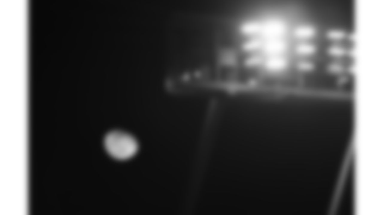 The moon under stadium lights at GEHA Field at Arrowhead Stadium during a week 14 NFL football game between the Kansas City Chiefs and the Houston Texans, Sunday, December 7, 2025 in Kansas City, MO.