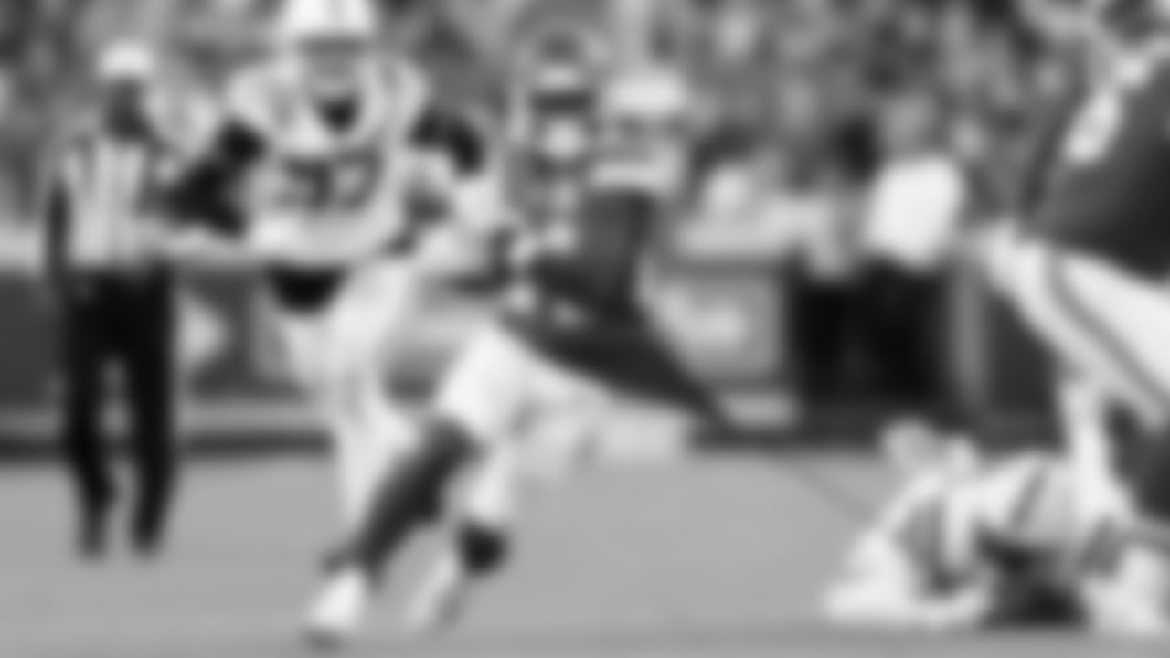 Kansas City Chiefs running back Brashard Smith (24) gets his shirt torn while he runs the ball during a week 12 NFL football game against the Indianapolis Colts, Sunday, November 23, 2025 in Kansas City, MO.