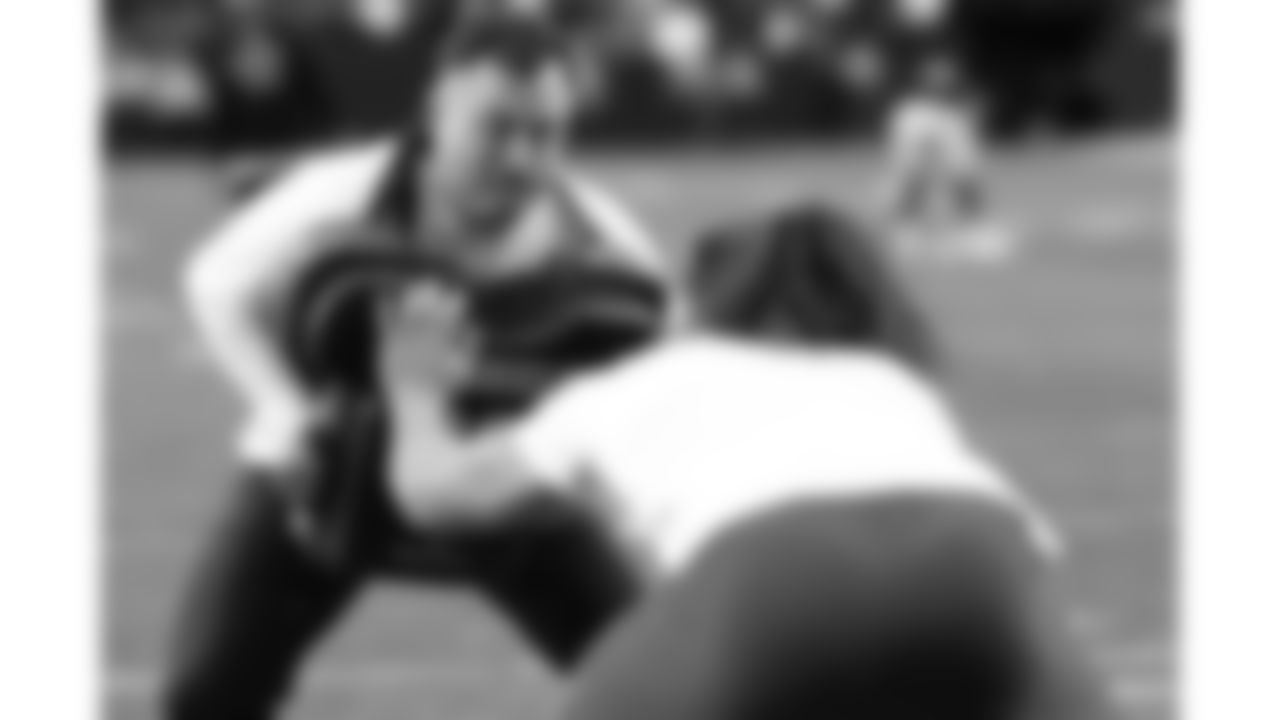 Kansas City Chiefs Assistant Defensive Line Coach Alex Whittingham warms up with defensive end Ashton Gillotte (97) prior to a week 18 game against the Las Vegas Raiders on Sunday, January 3, 2026.