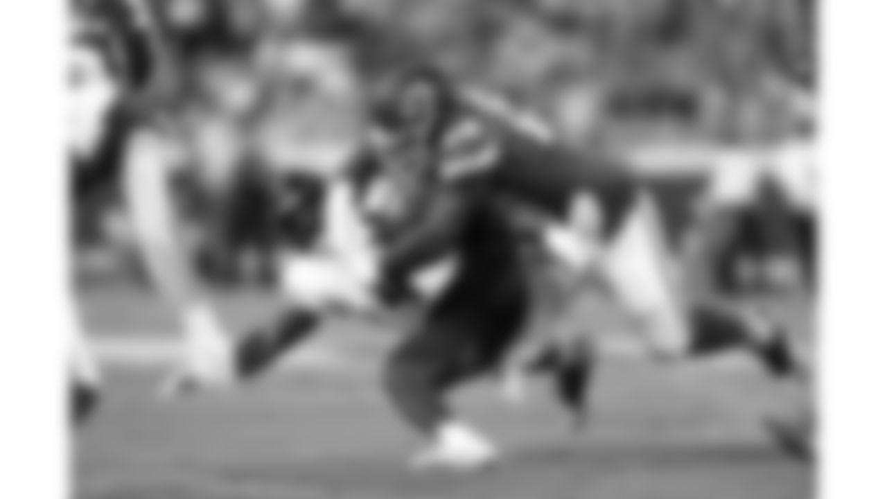 Kansas City Chiefs nose tackle Mike Pennel (69) tackles Chicago Bears running back D'Andre Swift (4) during a preseason week 3 NFL football game, Friday, August 22, 2025 in Kansas City, MO.