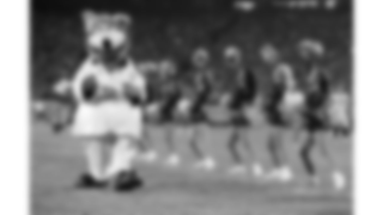 KC Wolf performs in an Elvis costume during a 2000 home game.