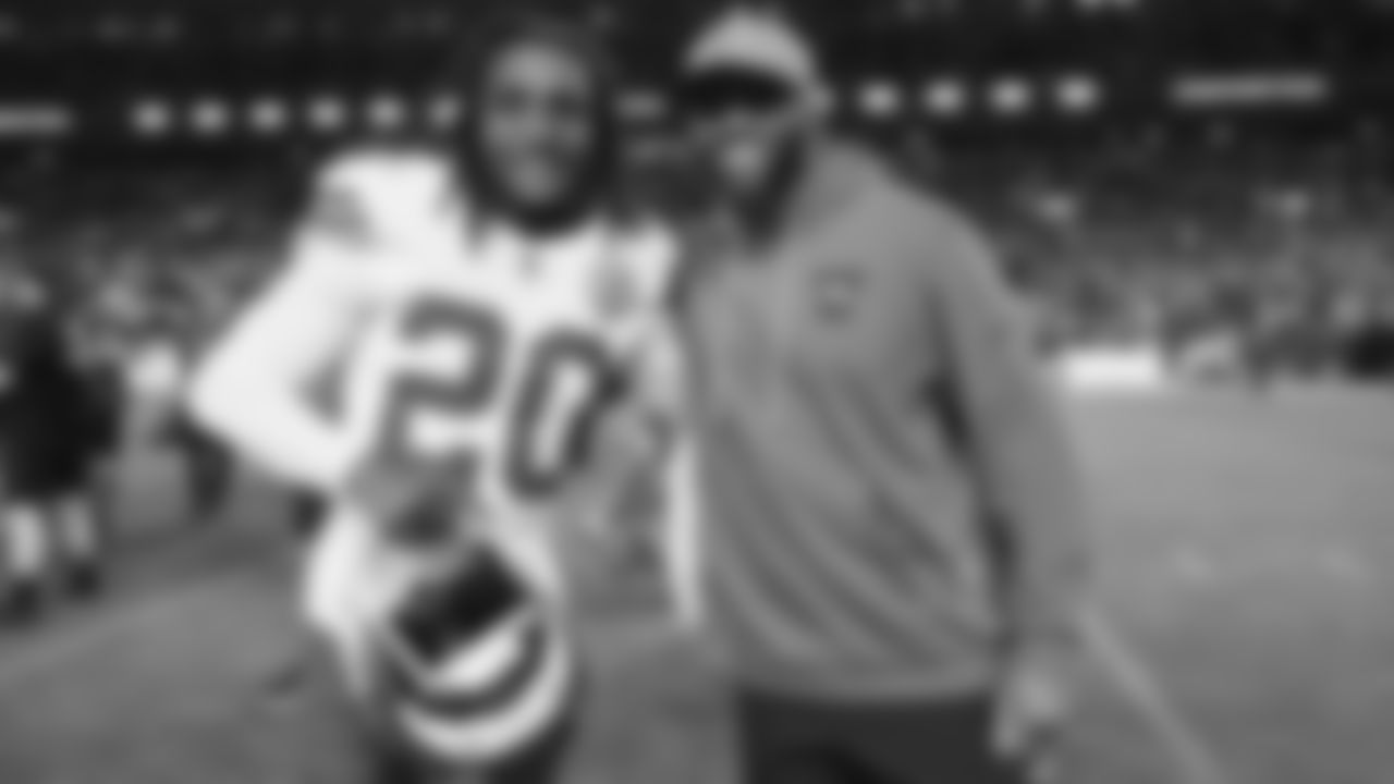 Kansas City Chiefs defensive back Nohl Williams (20) and a Broncos coaching staff member after a week 11 NFL Football game against the Denver Broncos on Sunday, November 16, 2025 in Denver, Colorado.