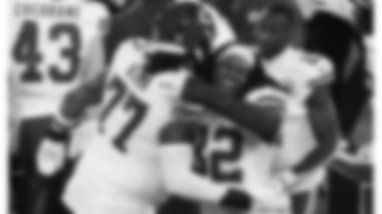 Kansas City Chiefs offensive lineman Lucas Niang (77) and linebacker Nick Bolton (32) celebrate after the AFC Championship Game against the Baltimore Ravens on Sunday, January 28, 2024 in Baltimore.