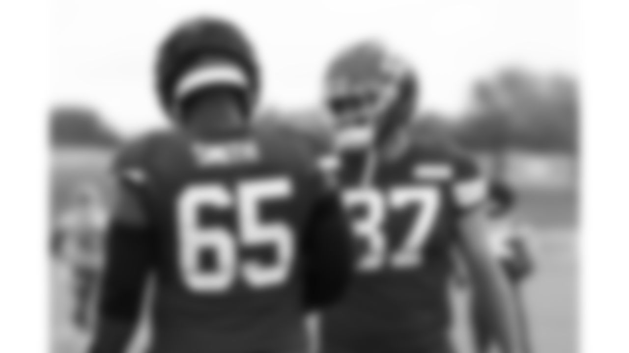 Kansas City Chiefs tight end Travis Kelce (87) and Kansas City Chiefs offensive lineman Trey Smith (65) on the field during training camp on day 4 of practice Friday, July 25, 2025.