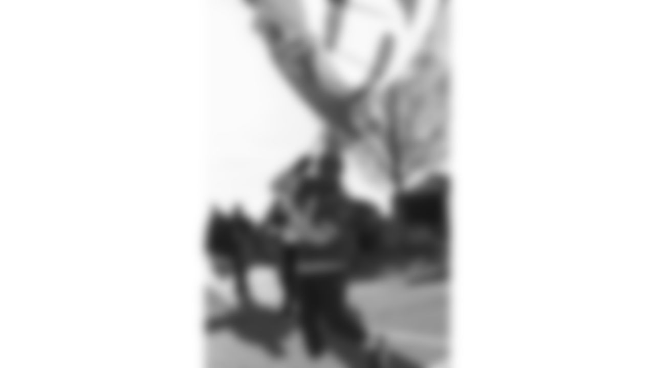 Chiefs Flag Runners prior to a week 15 NFL Football game against the Los Angeles Chargers on Sunday, December 14, 2025 in Kansas City, MO.