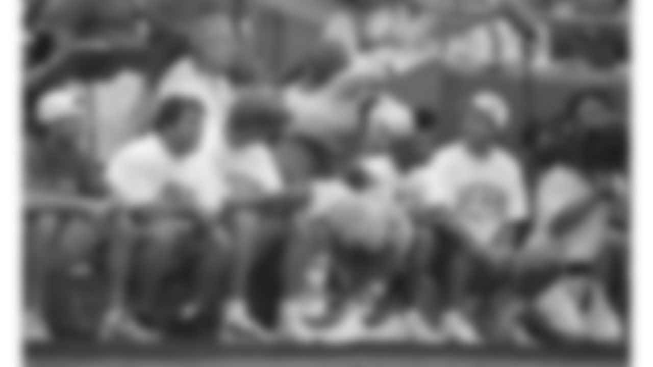 Tony DiPardo, KC Wolf, and the grounds crew, all sit in the back of the end zone during a 1996 home game.