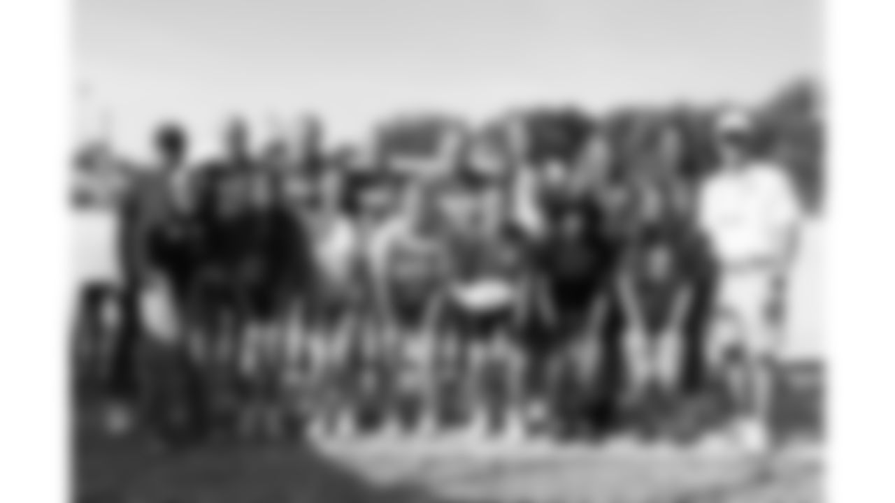 Kansas City Chiefs Chairman, CEO, and Owner Clark Hunt and the 18U girls flag team during training camp on day 6 of practice Monday, July 28, 2025.