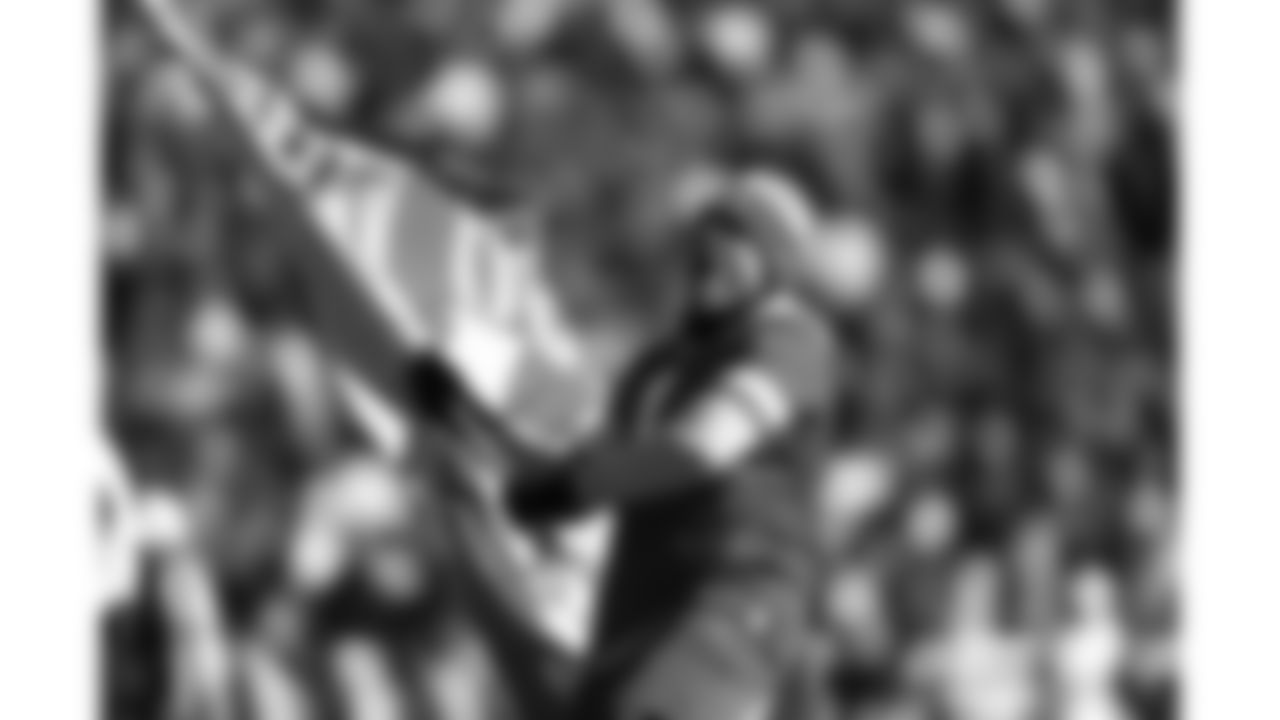 Chiefs Flag Runners wave during a week 15 NFL Football game against the Los Angeles Chargers on Sunday, December 14, 2025 in Kansas City, MO.