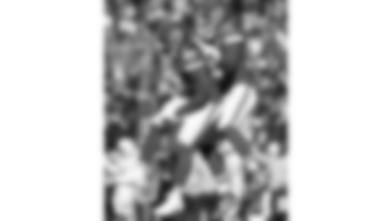 Kansas City Chiefs defensive end Mike Danna (51) and defensive end George Karlaftis (56) celebrate during a week 15 NFL football game against the Los Angeles Chargers, Sunday, December 14, 2025 in Kansas City, MO.