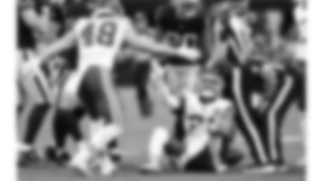 Kansas City Chiefs linebacker Cole Christiansen (48) helps defensive back Jaden Hicks (21) up during a week 18 NFL football game against the Las Vegas Raiders, Sunday, January 4, 2026 in Las Vegas, NV.