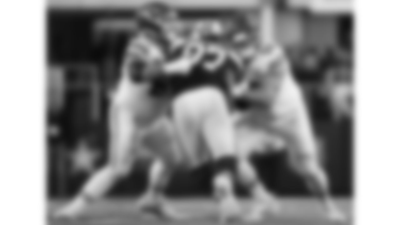 Kansas City Chiefs center Creed Humphrey (52) and offensive lineman Mike Caliendo block a defender during a week 13 NFL Football game against the Dallas Cowboys on Thursday, November 27, 2025 in Dallas, Texas.