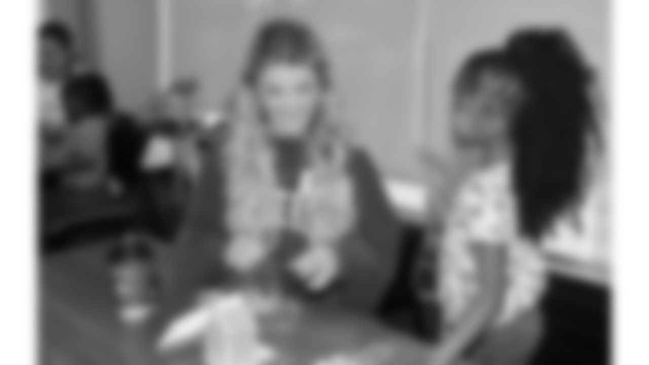 Women from the Chiefs Women's Organization visit with children at Operation Breakthrough on Thursday, December 5, 2024 in Kansas City, MO.
