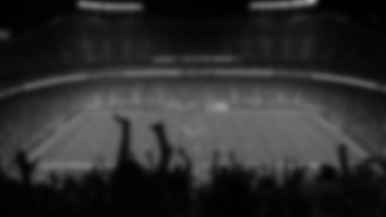 A silhouette of fans in the stands cheering during a preseason week 3 NFL football game against the Chicago Bears, Friday, August 22, 2025 in Kansas City, MO.