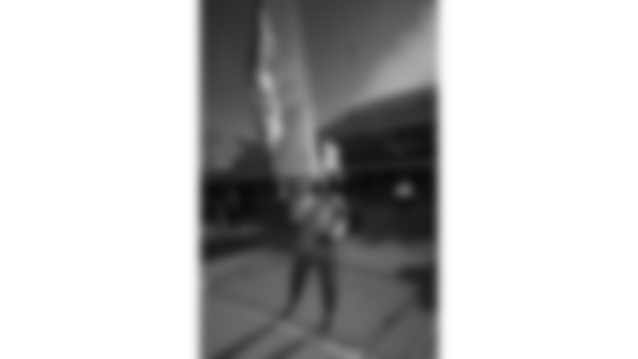 Chiefs Flag Runners prior to a week 15 NFL Football game against the Los Angeles Chargers on Sunday, December 14, 2025 in Kansas City, MO.