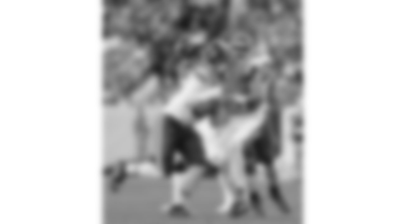 Kansas City Chiefs defensive end George Karlaftis (56) and defensive tackle Chris Jones (95) rush Broncos quarterback Bo Nix during a week 11 NFL Football game against the Denver Broncos on Sunday, November 16, 2025 in Denver, Colorado.