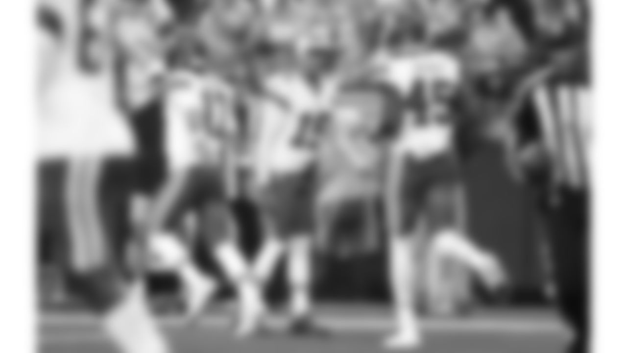 Kansas City Chiefs quarterback Patrick Mahomes (15) high fives Gardner Minshew (17) on the sideline during a preseason week 2 NFL football game against the Seattle Seahawks, Friday, August 15, 2025 in Seattle, WA.