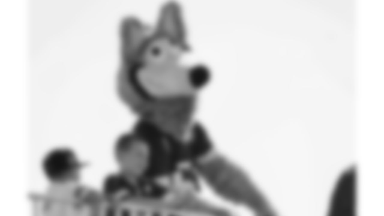 KC Wolf with fans during day 7 of training camp on Tuesday July 29, 2025