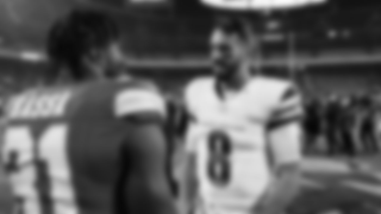 Kansas City Chiefs linebacker Jeffrey Bassa (31) talks with Washington Commanders quarterback Marcus Mariota (8) after a week 8 NFL Football game against the Washington Commanders on Monday, October 27, 2025 in Kansas City, MO.