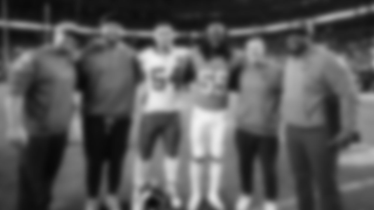 Kansas City Chiefs linebacker Leo Chenal (54), Broncos inside linebacker Jordan Turner (55), Defensive Quality Control Chris Orr, and Broncos coaching staff after a week 11 NFL Football game against the Denver Broncos on Sunday, November 16, 2025 in Denver, Colorado.