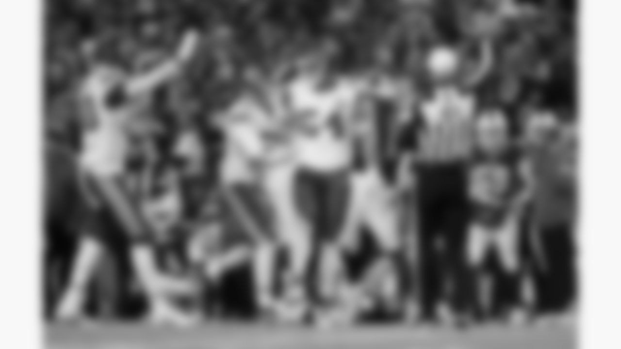 Kansas City Chiefs defensive end Charles Omenihu (90), defensive end George Karlaftis (56) and linebacker Leo Chenal (54) celebrate during a week 9 NFL football game against the Buffalo Bills, Sunday, November 2, 2025 in Buffalo, NY.