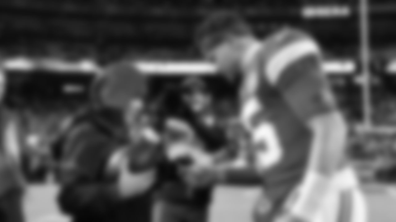 Kansas City Chiefs quarterback Patrick Mahomes (15) hands the Kingdom Champion, Trinity Tummons a game ball prior to an NFL week 14 matchup against the Houston Texans, Sunday December 7, 2025.