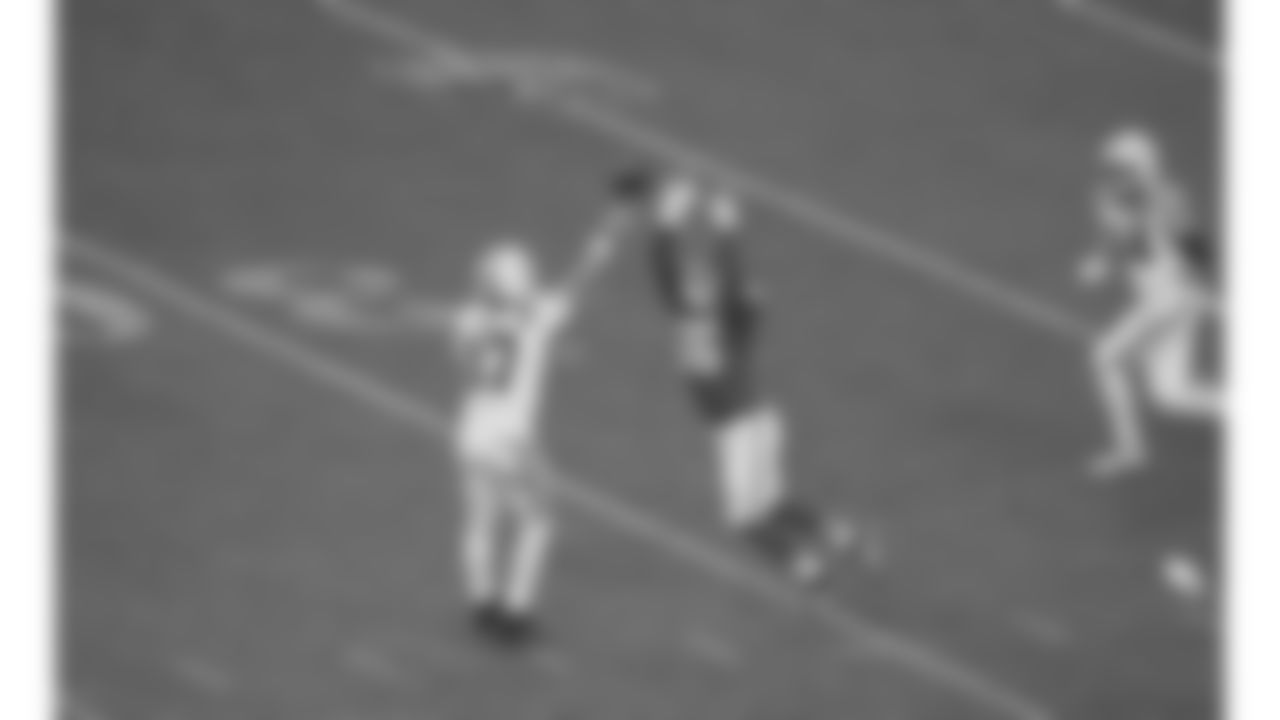 Kansas City Chiefs defensive end George Karlaftis (56) deflects a pass from Indianapolis Colts quarterback Daniel Jones (17) during a week 12 NFL football game, Sunday, November 23, 2025 in Kansas City, MO.