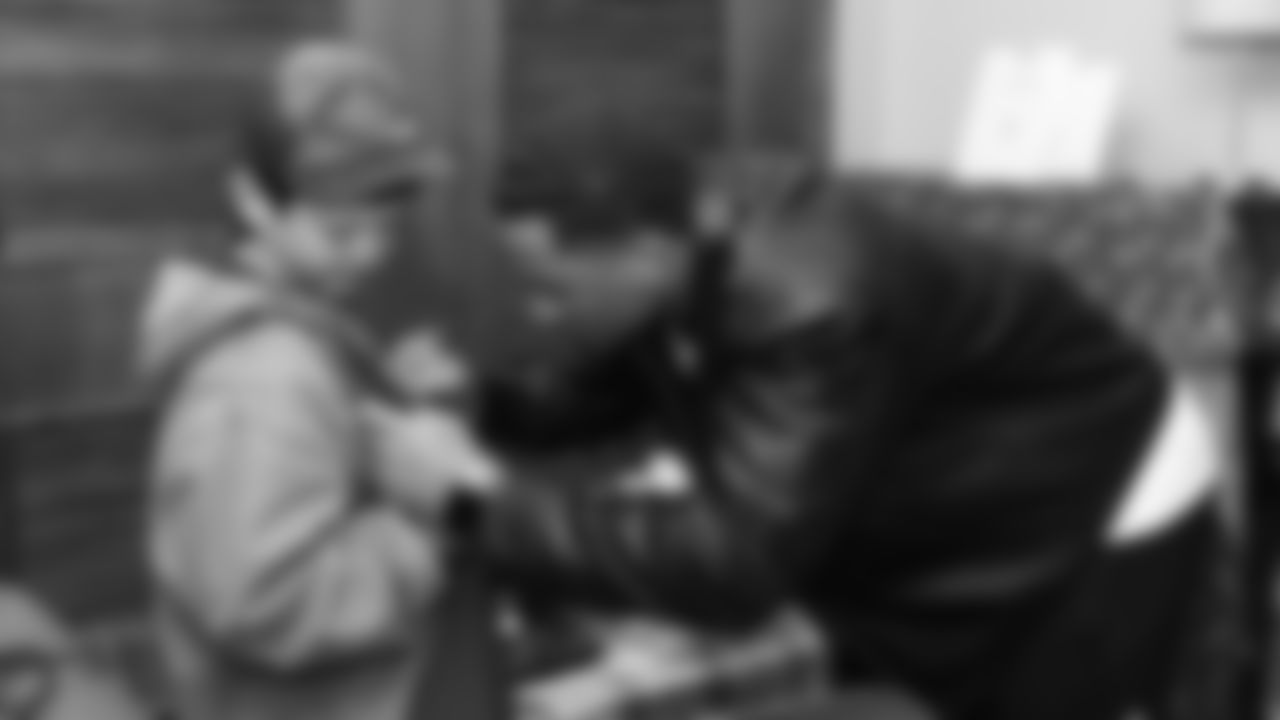 Kansas City Chiefs cornerback Trent McDuffies (22) signs a fans shirt before his My Cause My Cleats reveal at the Solace House in Shawnee Mission, Kansas on Tuesday, November 11, 2025.