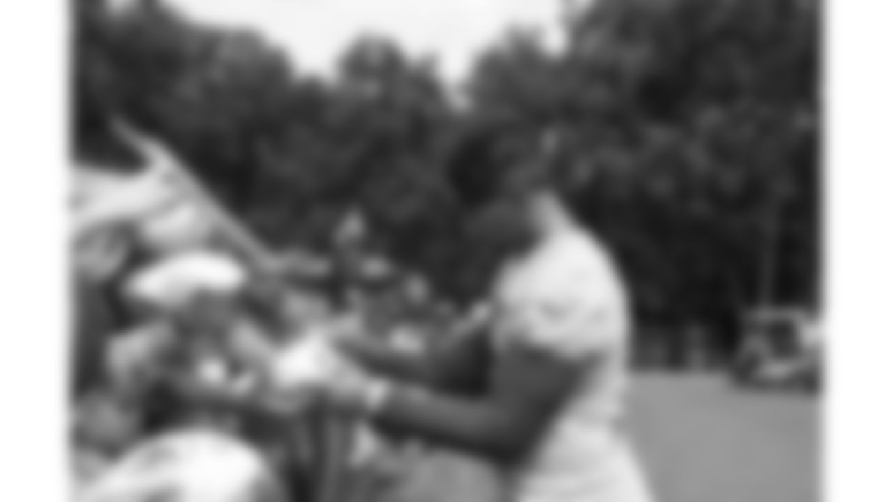 Kansas City Chiefs quarterback Patrick Mahomes (15) signs fans merchandise after Day 1 of training camp practice on Tuesday, July 22, 2025.