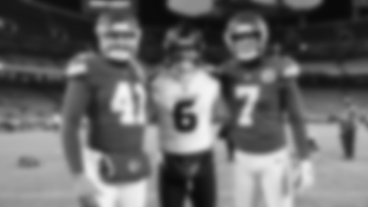 Long snapper James Winchester (41), Kansas City Chiefs kicker Harrison Butker (7) pose for a photo with Houston Texans punter Tommy Townsend (6) after an NFL week 14 matchup against the Houston Texans, Sunday December 7, 2025.