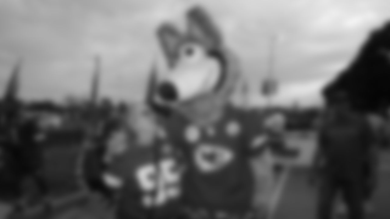 KC Wolf and a fan prior to a week 6 NFL Football game against the Detroit Lions on Sunday, October 12, 2025 in Kansas City, MO.