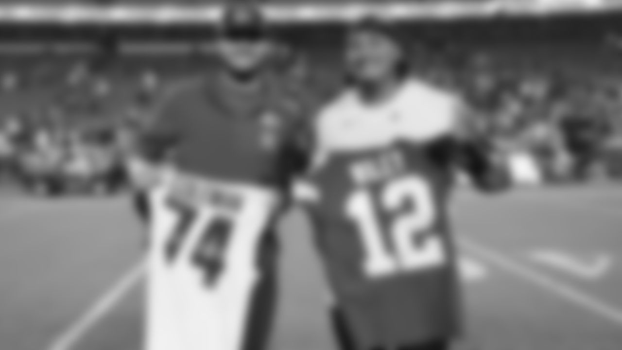 Kansas City Chiefs tight end Jared Wiley (12) swaps jerseys with Washington Commanders guard Brandon Coleman (74) after a week 8 NFL Football game against the Washington Commanders on Monday, October 27, 2025 in Kansas City, MO.