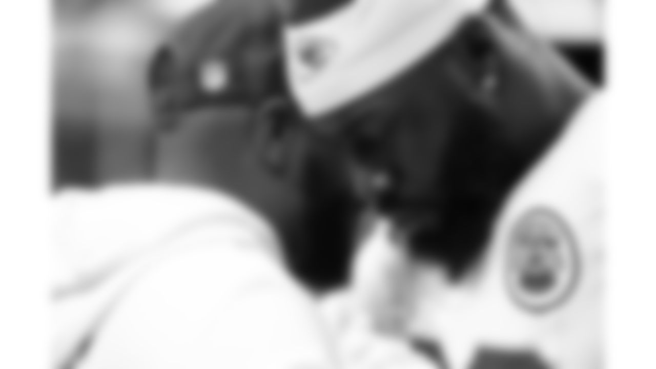 Kansas City Chiefs defensive end Charles Omenihu (90) prays with team chaplain Marcellus Casey prior to a week 18 game against the Las Vegas Raiders on Sunday, January 3, 2026.