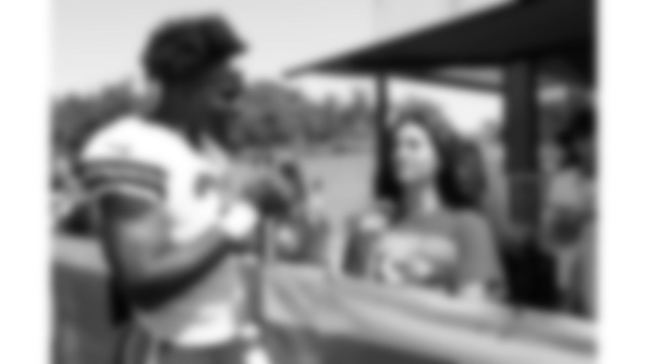 Kansas City Chiefs linebacker Jeffrey Bassa (31) meets with the 18U Girls Flag team after training camp on day 6 of practice Monday, July 28, 2025.