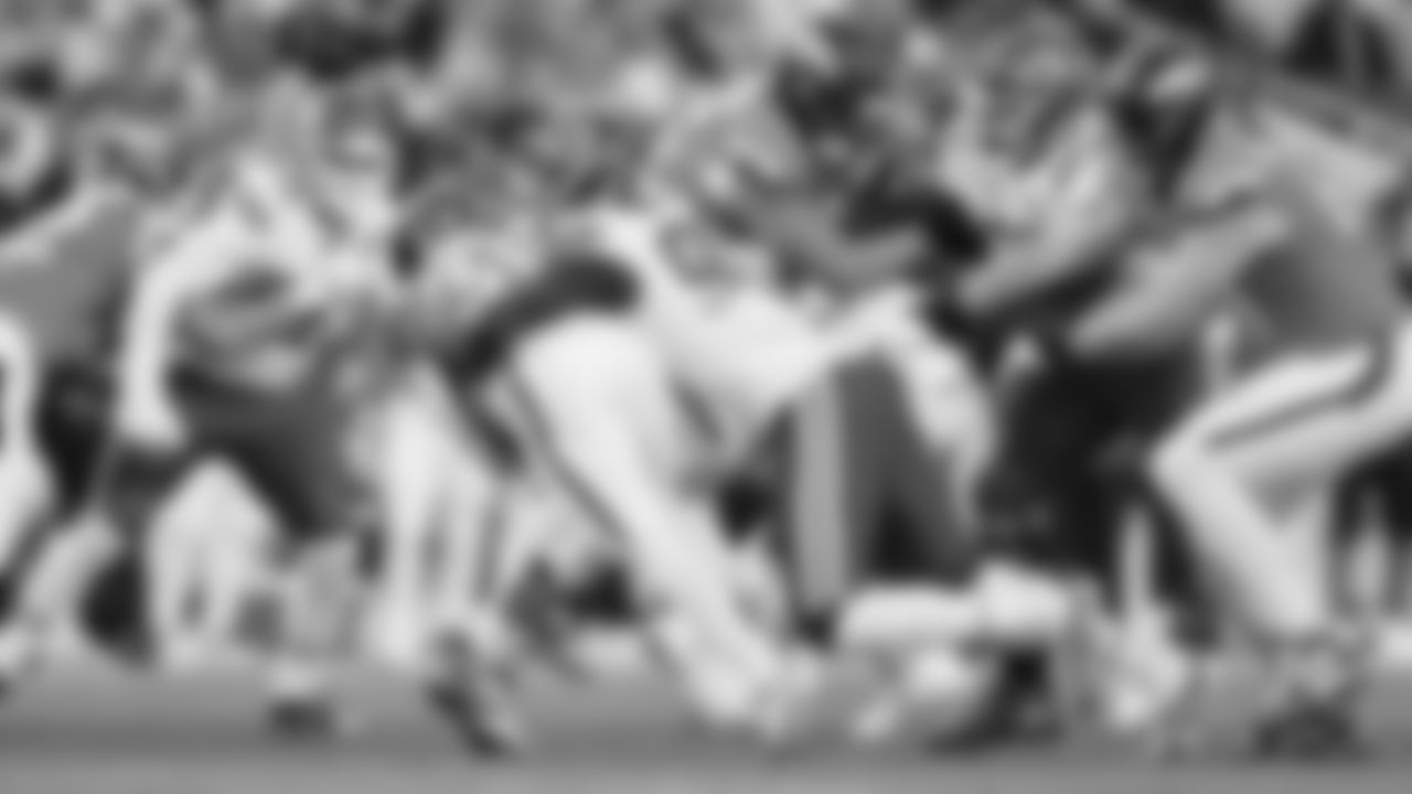 Kansas City Chiefs defensive end Charles Omenihu (90) makes a tackle during a week 11 NFL Football game against the Denver Broncos on Sunday, November 16, 2025 in Denver, Colorado.