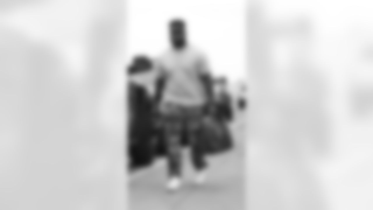 Kansas City Chiefs offensive lineman Trey Smith (65) arrives for an NFL preseason week 3 matchup against the Chicago Bears, Thursday August 22, 2024