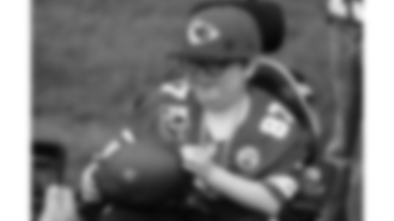 Josh "Turbo" Pham, a child battling an aggressive disease, visits practice during phase 3 of OTAs on Friday, June 13, 2025 in Kansas City, MO.