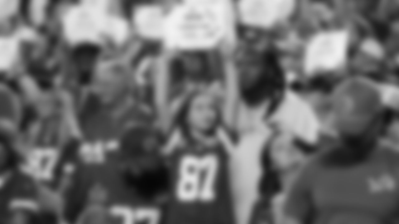 Fan holds up I Cheer for Crucial Catch sign during a week 6 NFL Football game against the Detroit Lions on Sunday, October 12, 2025 in Kansas City, MO.