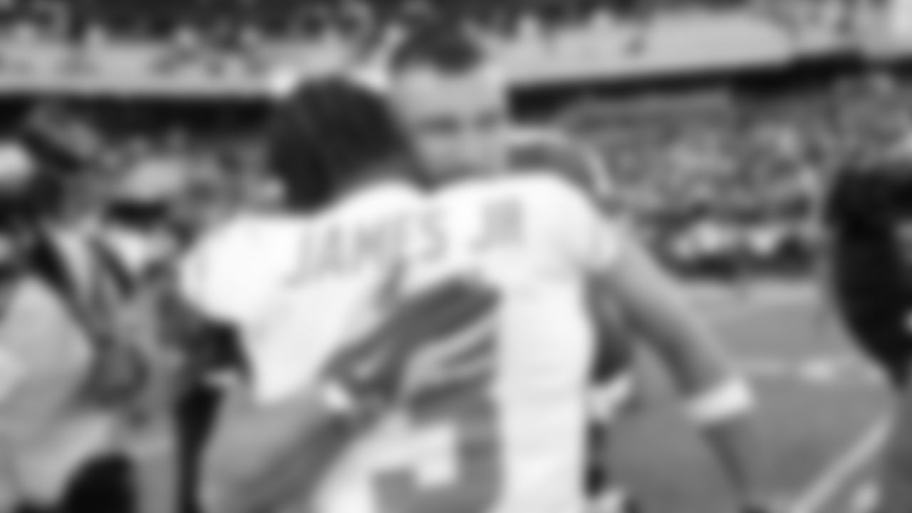 Kansas City Chiefs tight end Travis Kelce (87) hugs San Diego Chargers safety Derwin James Jr. (3) after an NFL week 15 matchup against the Los Angeles Chargers, Sunday December 14, 2025.