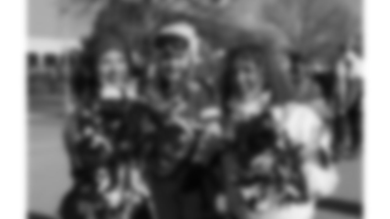 Kansas City Chiefs Cheerleaders pose with a young fan prior to a week 15 NFL Football game against the Los Angeles Chargers on Sunday, December 14, 2025 in Kansas City, MO.