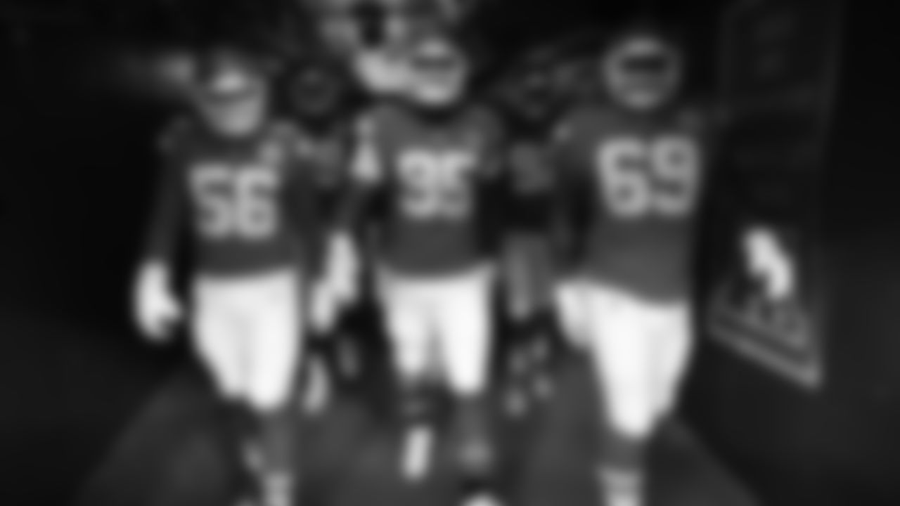 Defensive end George Karlaftis (56), Tackle Chris Jones (95), and Kansas City Chiefs nose tackle Mike Pennel (69) walk down the 50 yard line tunnel prior to a week 12 NFL Football game against the Indianapolis Colts on Sunday, November 23, 2025 in Kansas City, MO