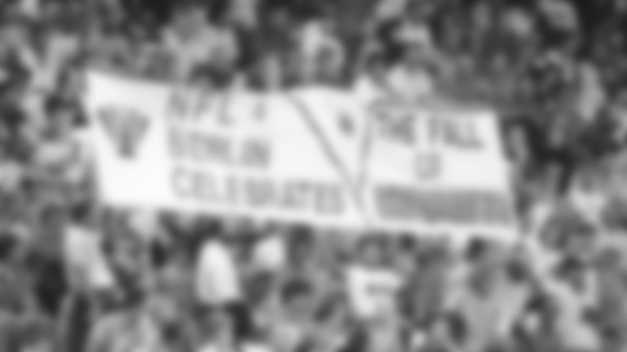 Fans hold up a sign in the stands during the 1990 preseason game against the Los Angeles Rams in Berlin, Germany.