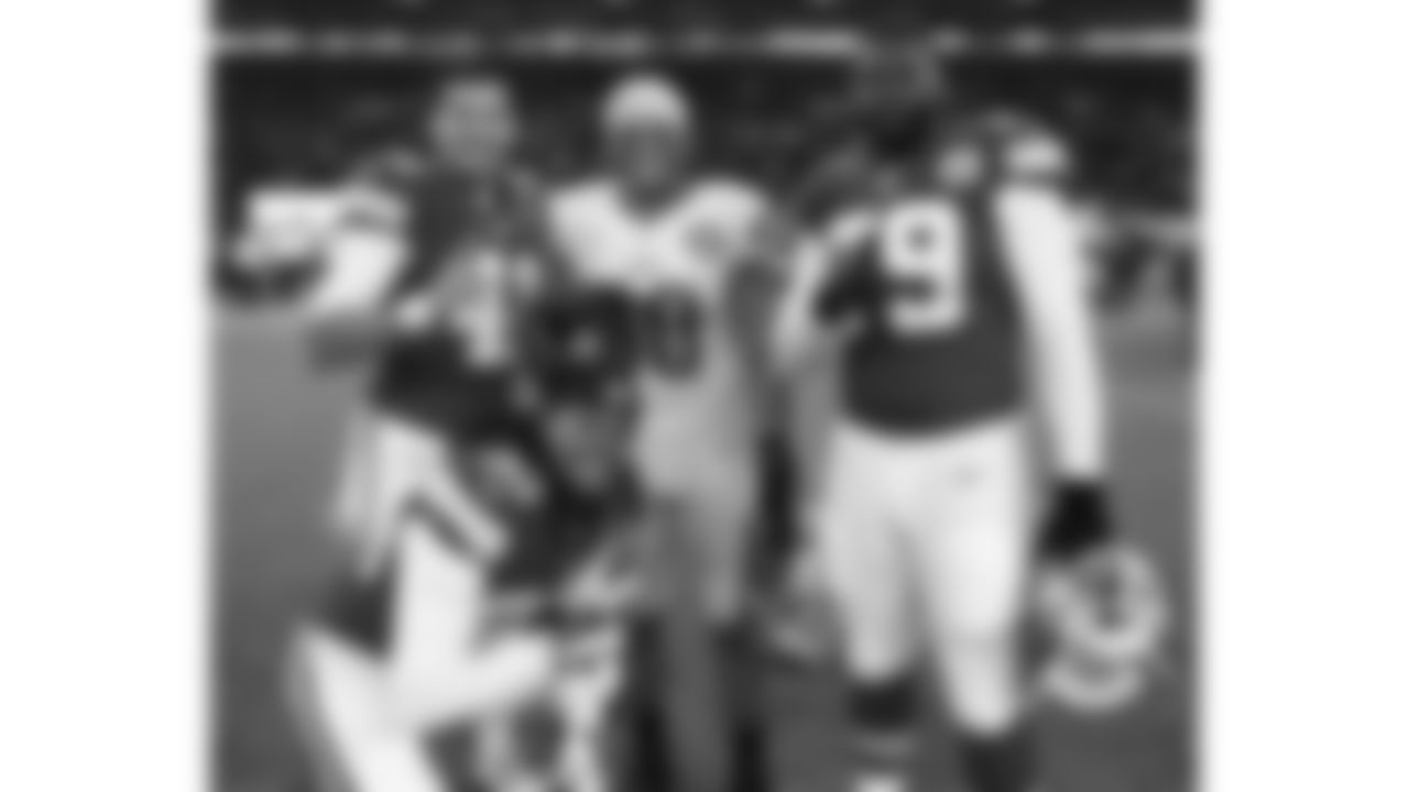 Kansas City Chiefs special teams player James Winchester (41), offensive lineman Donald Stephenson (79), defensive back Jamell Fleming (30), and Detroit Lions Josh Wilson (30) pose for a photo following the 2015 game against the Detroit Lions at Wembley Stadium in London.